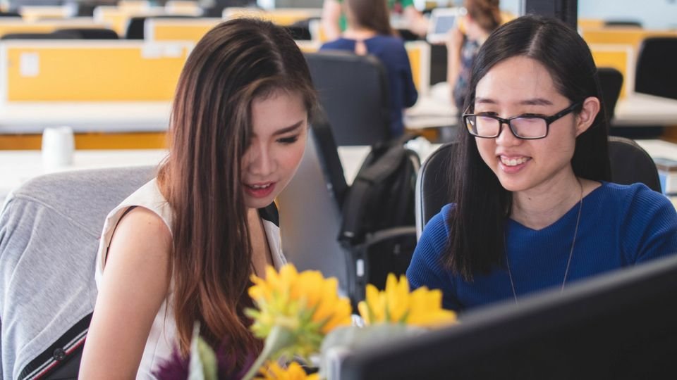 young women working by mimi thian on unsplash compressor